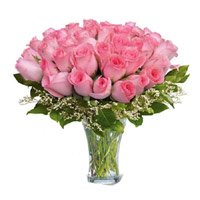 Send Online New Year Flowers to Vijayawada comprising Pink Roses in Vase 50 Flowers to Hyderabad