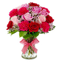 Order Online new Year Flowers to Hdyerabad that includes Red Carnation Pink Red Rose in Vase 12 Flowers