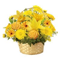 Deliver Diwali Flowers to Hyderabad comprising Yellow Lily, Gerbera, Rose, Carnation Basket 12 Flowers to Hyderabad Online