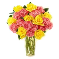 Send Diwali Flowers Online Pink Carnation Yellow Rose in Vase 24 Flowers to Hyderabad