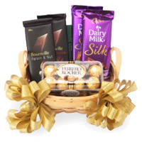 Online New Year Gifts to Hyderabad containing Silk, Bournville and Ferrero Rocher Chocolate Basket
