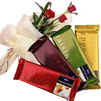 Place Online Order for Christmas Gifts like 4 Cadbury Temptation Chocolates With 3 Red Roses Flowers to Hyderabad