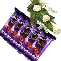 Same Day New Year Gifts to Secunderbad comprising 5 Cadbury Silk Bubbly Chocolate With 3 White Roses