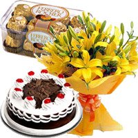 12 Yellow Lily, 1/2 Kg Black Forest Cake, 16 Pcs Ferrero Rocher Chocolate Delivery in Hyderabad