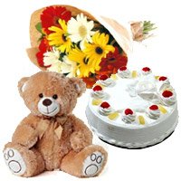 New Year Flowers to Hyderabad anf Gifts to Vijayawada containing 12 Gerbera Bouquet, 1 Kg Pineapple Cake in Hyderabad and 1 Teddy Bear