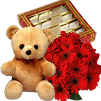 Friendship Day Flower Online to Hyderabad including of 12 Gerbera Bouquet, 1/2 Kg Kaju Burfi, 1 Teddy Bear