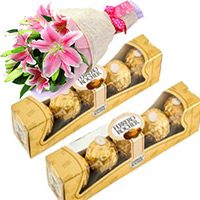 Christmas Gifts Deliver to Hyderabad consist of Ferrero Rocher Chocolates 10 Pieces with 2 Lily Stem to Hyderabad Online