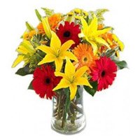 Flowers to Hyderabad send to Lily Gerbera Bouquet in Vase 12 Flowers to Hyderabad