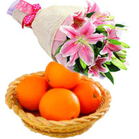 Send New Year Gifts to Vizag consisitng Pink Lily Flower Bouquet in Hyderabad with 3 Stems and 12 pcs Fresh Orange
