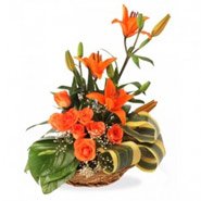 Order Online 3 Orange Lily 6 Orange Roses Basket 12 Rakhi Flowers to Hyderabad