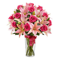 New Year Flowers in Hyderabad. 4 Pink Lily 15 Pink Rose Vase