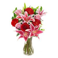Cheapest Rakhi Flower Delivery in Hyderabad. 4 Pink Lily 4 Pink Rose 4 Red Gerbera Vase