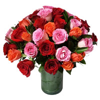 Place Online Order to Send New Year Flwoers to Hyderaba consisting Pink, Red, Orange Roses Vase 24 Flowers