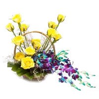 Send 6 Orchids and 12 Roses Arrangement of Rakhi Flowers to Hyderabad
