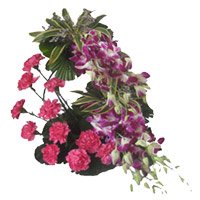 6 Orchids 12 Pink Carnation Flower Arrangement. New Year Flowers Delivery in Secunderabad