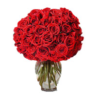 Midnight New Year Flower Delivery in Hyderabad incorporated Red Roses in Vase 100 Flowers to Hyderbad
