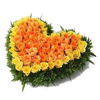 Same Day New Year Flowers to Vizag incorporated with Yellow Orange Roses Heart 100 Flowers in Hyderabad
