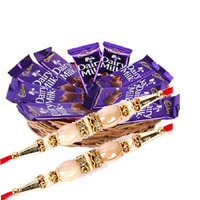 Send 12 Dairy Milk Chocolate Basket With 1 Red Rose Flowers Bud. Chocolates with Rakhi to Hyderabad