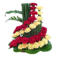 Red Yellow Carnation Arrangement 50 Flowers to Hyderabad. Valentine's Day Flowers to Secunderabad