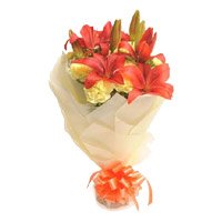 Deliver Diwali Flowers in Hyderabad consist of 2 Orange Lily 12 Yellow Carnation Online Flowers Bouquet in Hyderabad