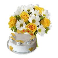 New Year Gift Delievry in Hyderabad comprising White Gerbera Yellow Roses 18 Flowers 1 Kg Pineapple Cake