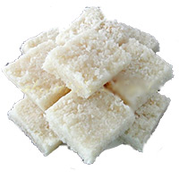 Same Day New Year Sweets to Hyderabad containing 1 Kg Coconut Barfi